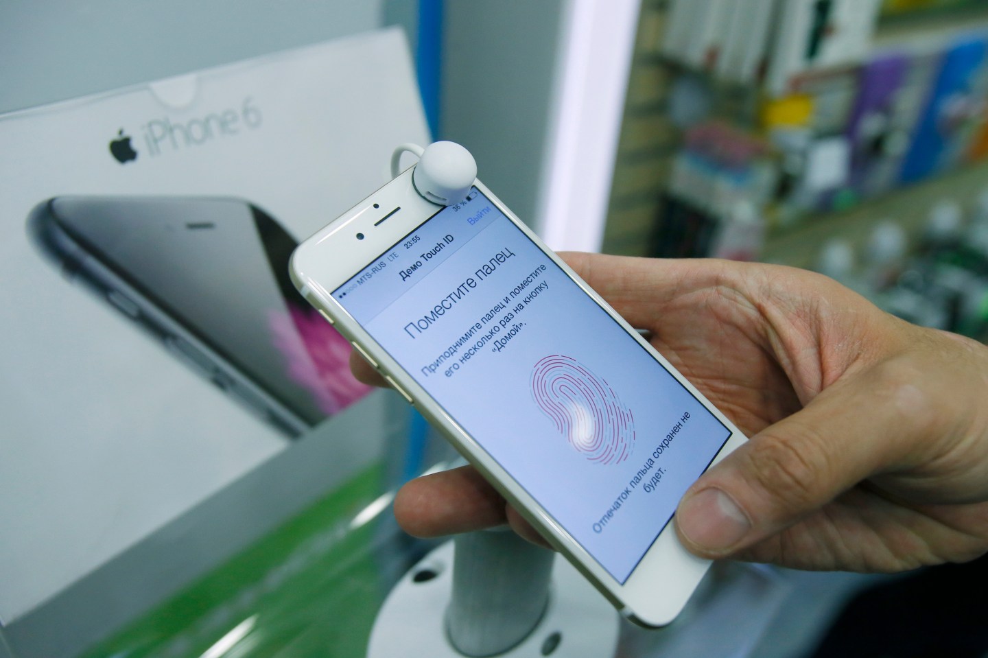 A man holds an iPhone 6 in a mobile phone shop in Moscow