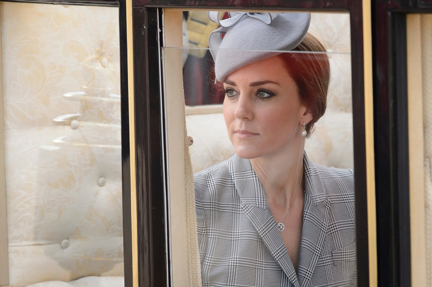 Britain's Catherine, Duchess of Cambridge takes her seat in a State Carriage for the carriage procession to Buckingham Palace in London