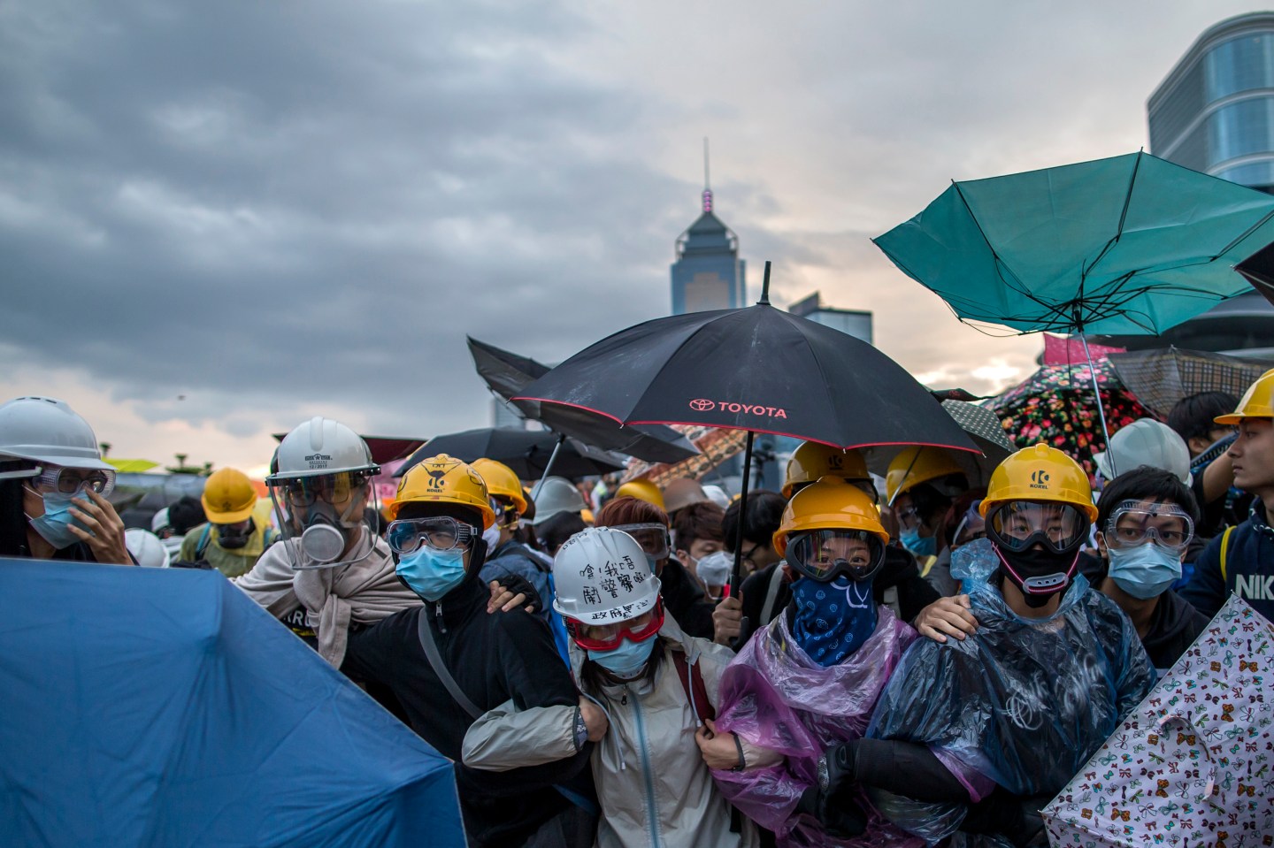 Pro-democracy protesters gather as police as riot police attempt to clear a demonstration site near the officer of the Chief Executive in Hong Kong