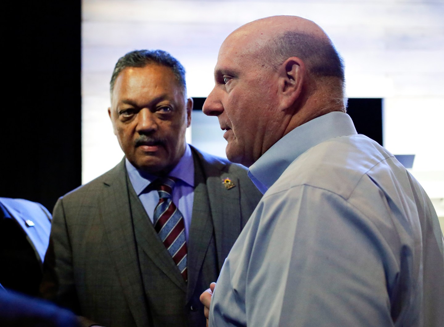 The Reverend Jesse Jackson and former Microsoft Corp Chief Executive Steve Ballmer attend the annual shareholders' meeting in Bellevue, Washington