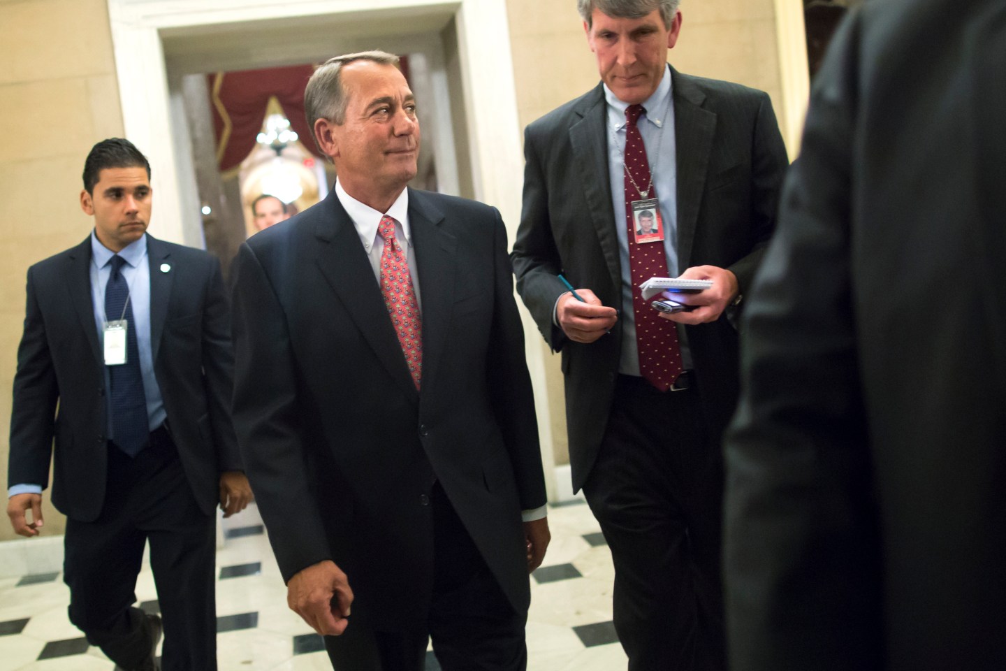 Boehner walks to his office after passage of spending bill on the House floor at the U.S. Capitol in Washington