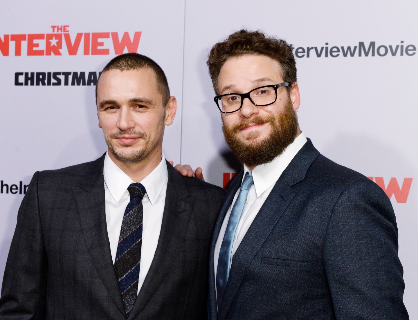 Cast members James Franco and Seth Rogen pose during premiere of the film "The Interview" in Los Angeles
