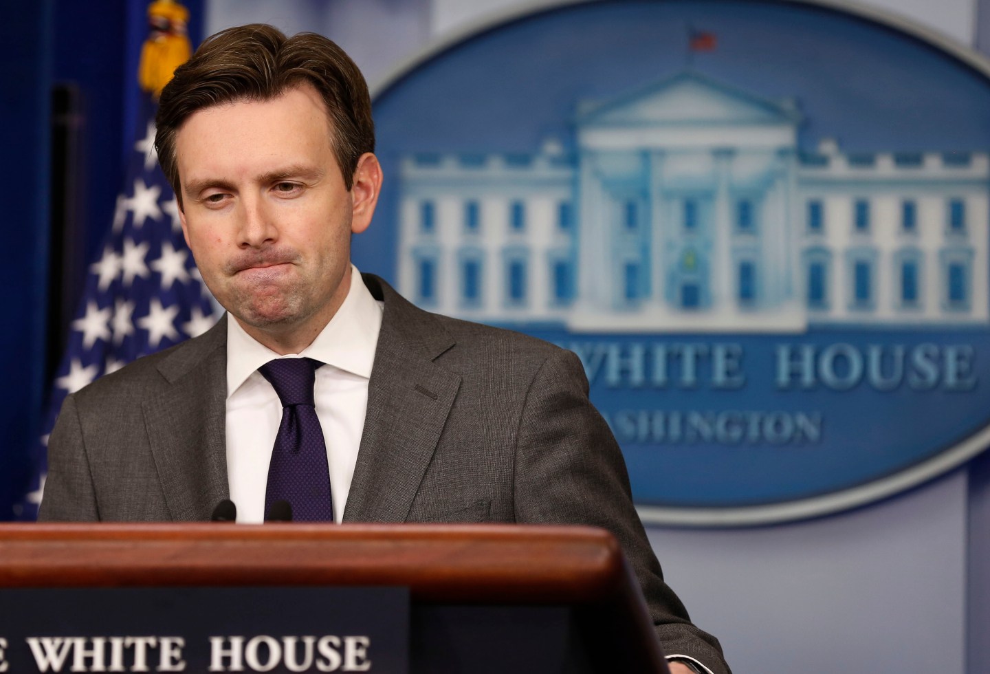 White House Press Secretary Earnest pauses while answering a question about North Korea in the Brady Press Briefing Room at the White House in Washington
