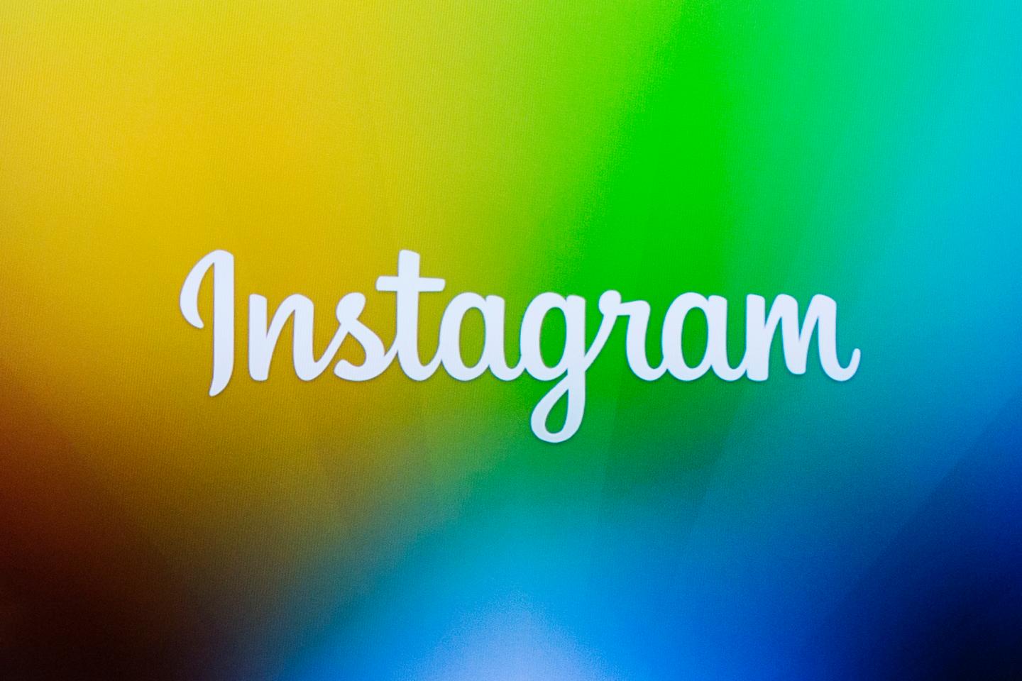A screen displays the Instagram logo during a presentation by co-founder Kevin Systrom as he announces the launch of a new direct image messaging service named Instagram Direct in New York