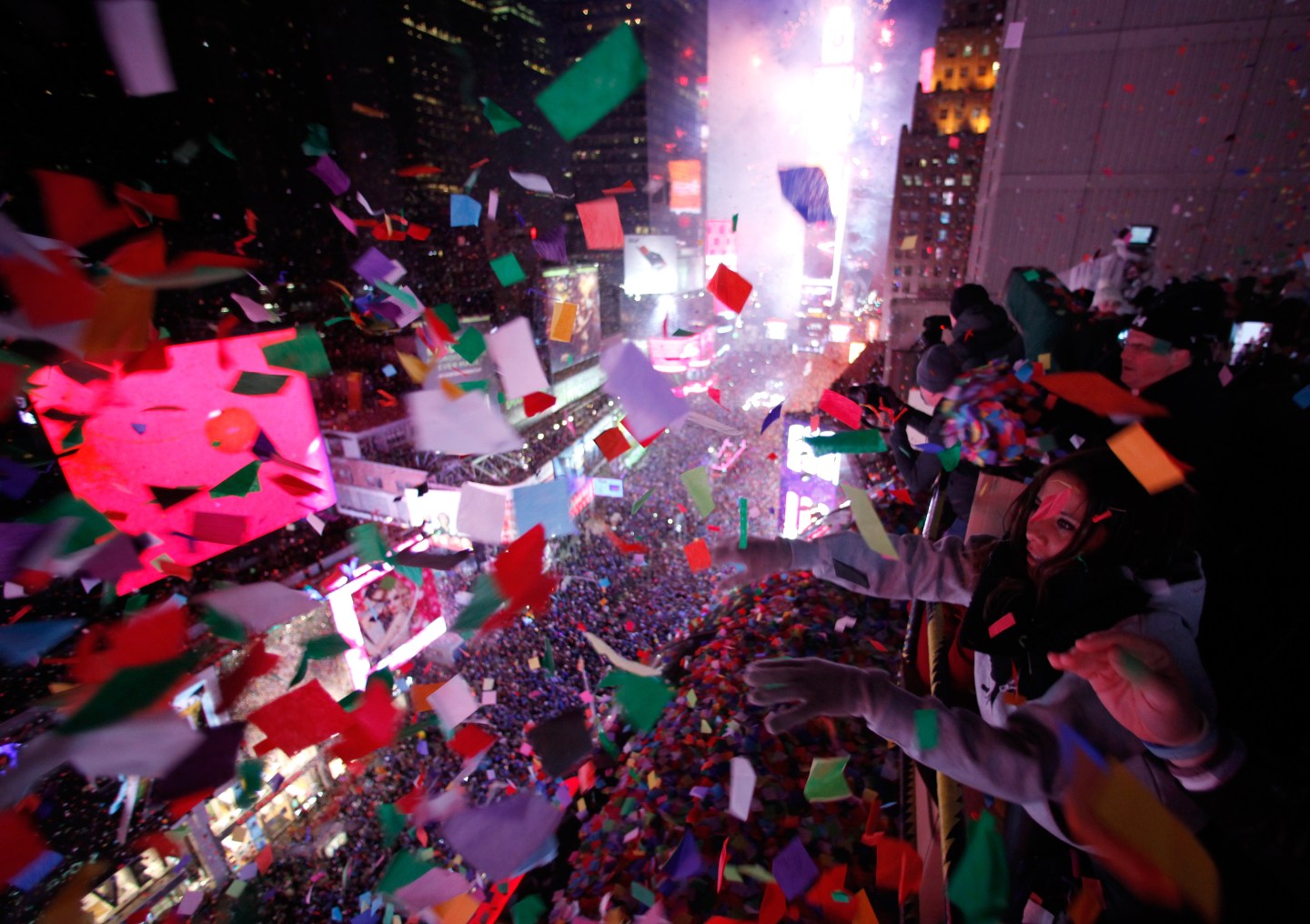 Confetti is dropped on revelers at midnight during New Year's Eve celebrations in Times Square in New York