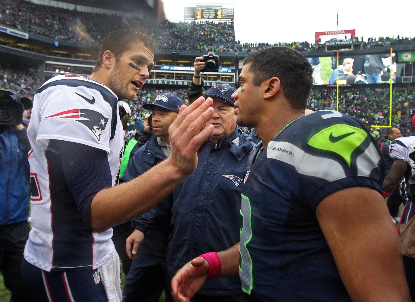 10-14-2012: Seattle, WA: POSTGAME.........Patriots quarterback Tom Brady (left) has a word and a pat for Seattle quarterback Russell Wilson (right) following the Seahawks 24-23 victory ovewr New England. The New England Patriots visited the Seattle Seahawks in an NFL regular season game at CenturyLink Field. section: sports (Jim Davis/Globe Staff)