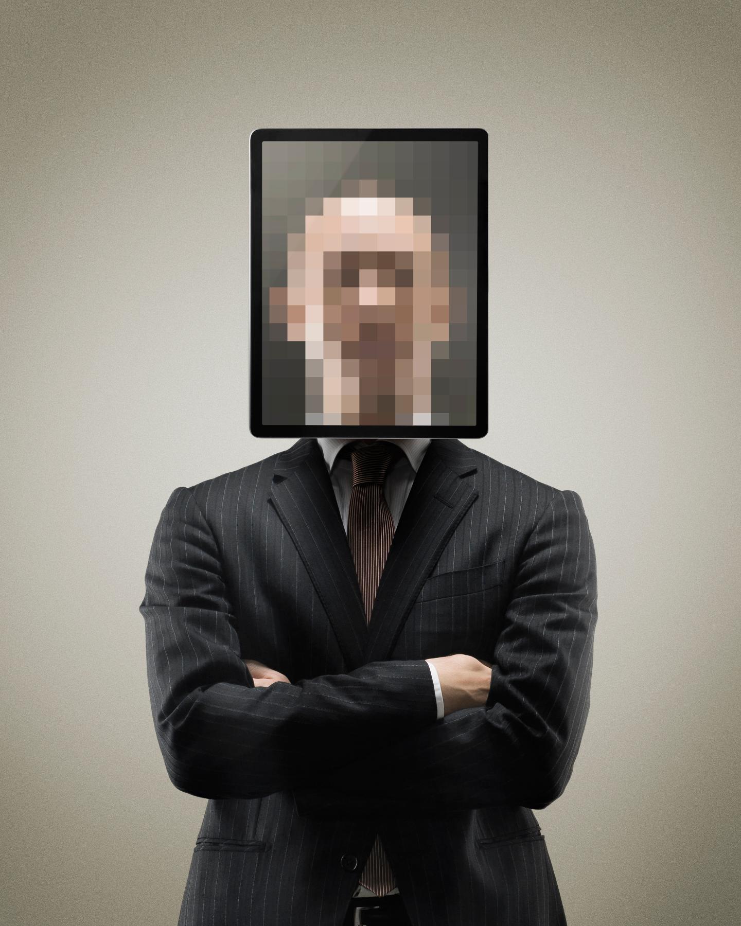 Pixellated portrait of man with digital tablet