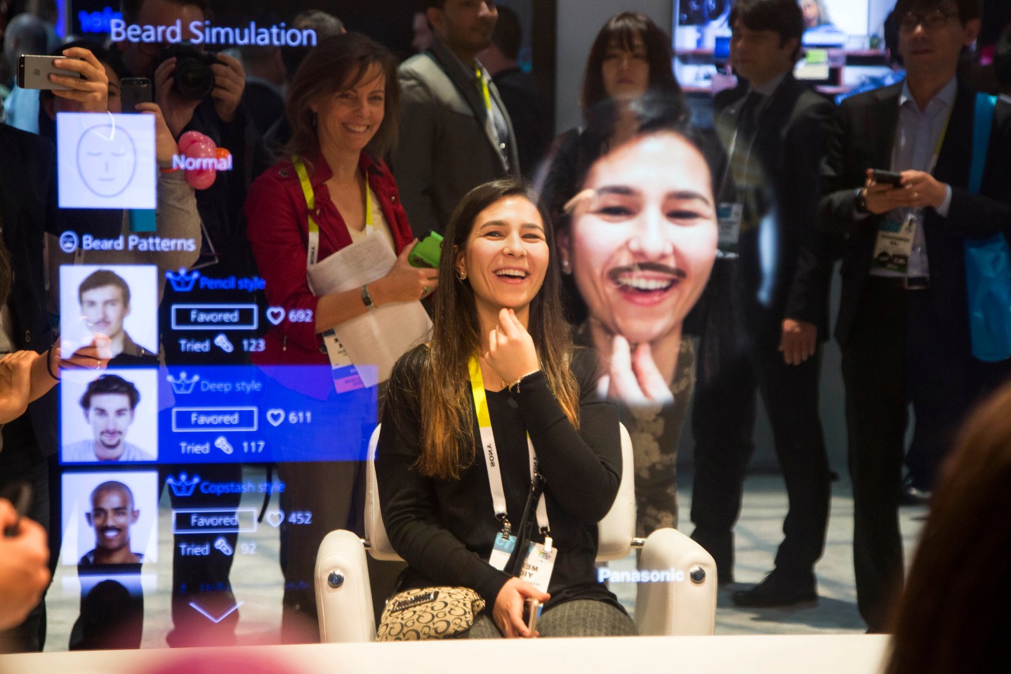 An attendee tries out the beard simulation effect on a Panasonic Corp. Smart Mirror during the 2015 Consumer Electronics Show (CES) in Las Vegas, Nevada, U.S., on Tuesday, Jan. 6, 2015. This year's CES will be packed with a wide array of gadgets such as drones, connected cars, a range of smart home technology designed to make everyday life more convenient and quantum dot televisions, which promise better color and lower electricity use in giant screens. Photographer: Michael Nagle/Bloomberg via Getty Images