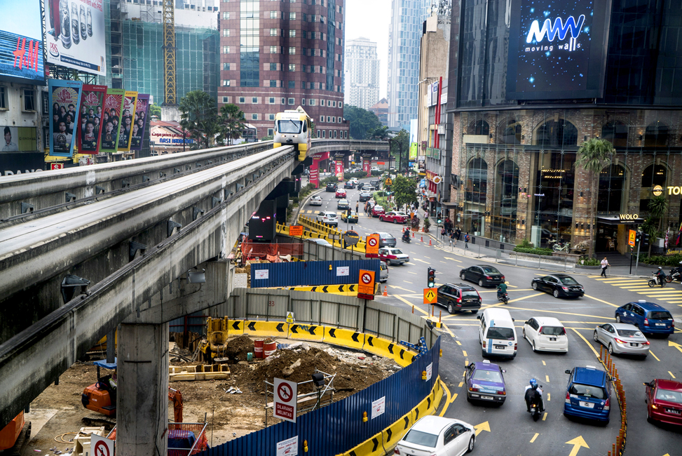 A monorail approaches in Kuala Lumpur, the frenetic, fast-growing capital city of Malaysia.