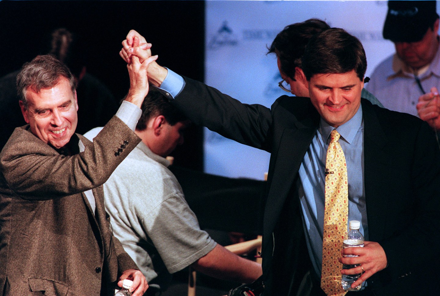 Gerald Levin of Time Warner, left, with Stephen Case of America Online, announcing A.O.L.'s $165 billion deal to acquire Time Warner in January 2000.