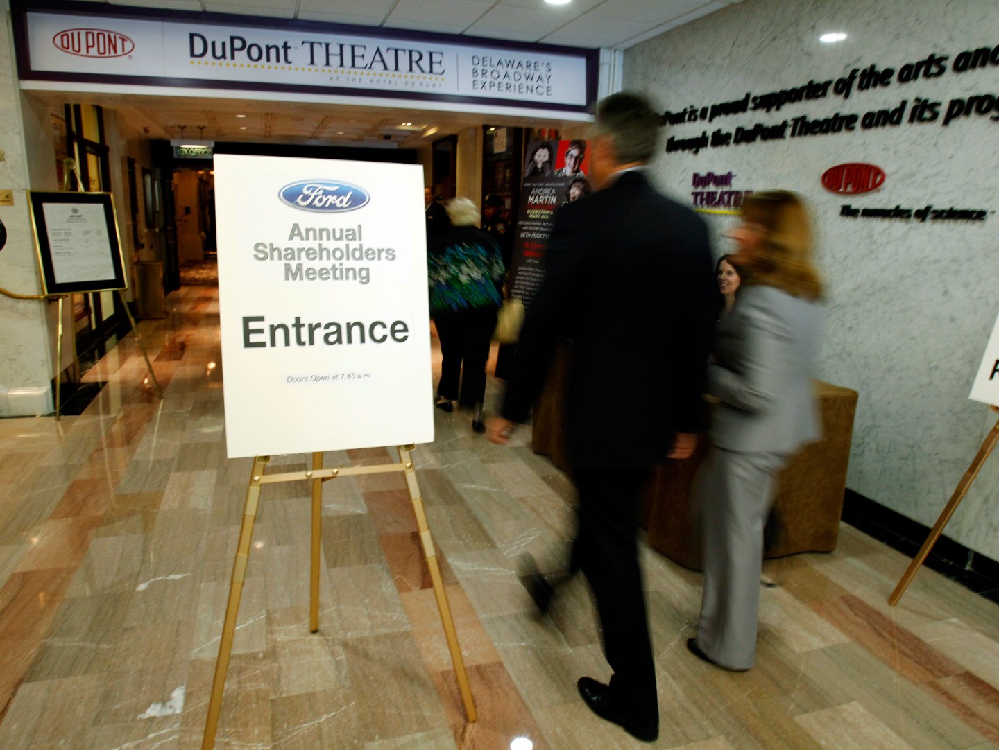 Shareholders walk toward the DuPont theater for the Ford Motor Company annual meeting of shareholders in Wilmington Delaware