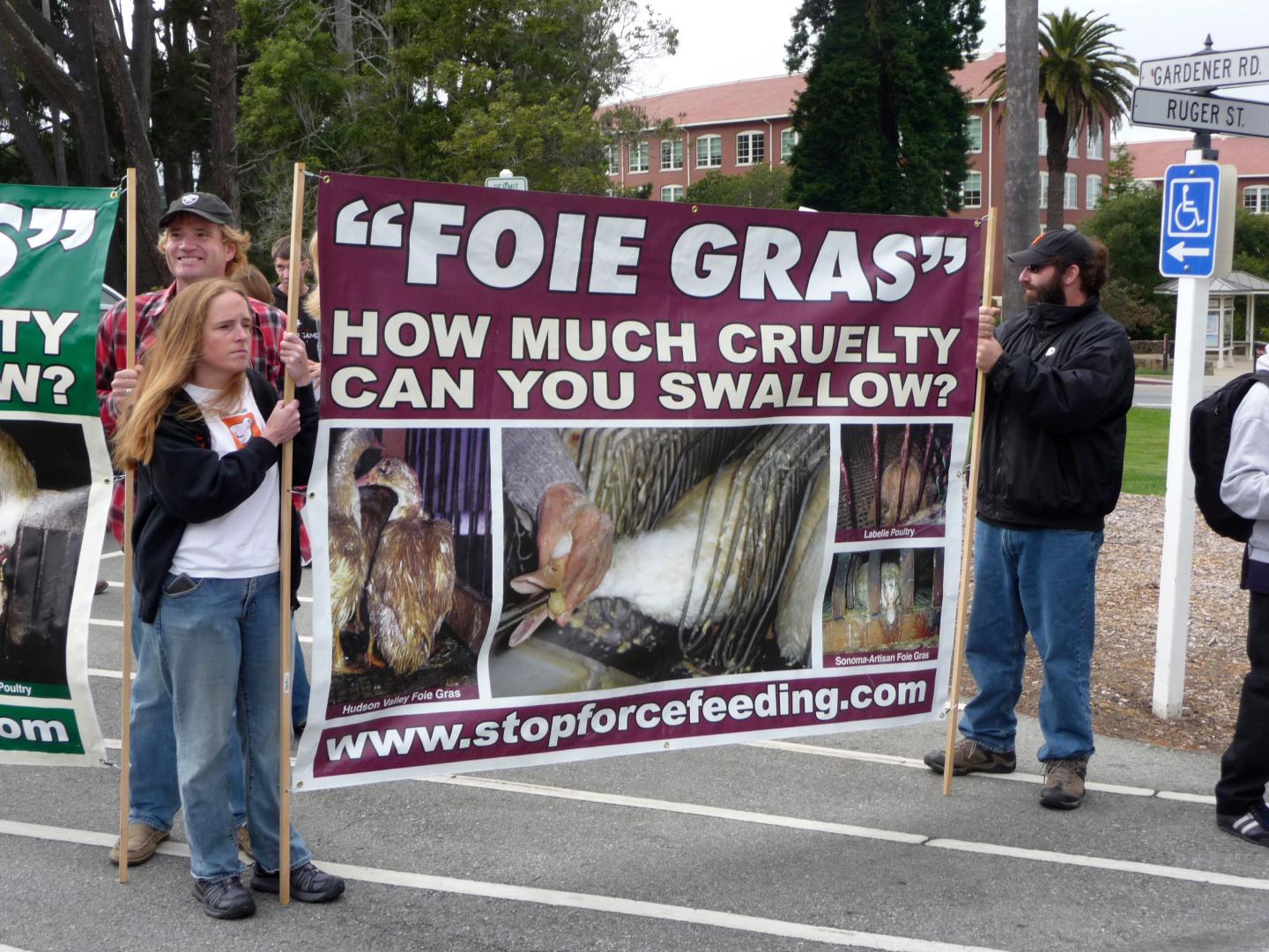 Animal rights activists protest the Presidio Social Club restaurant's decision to serve foie gras in San Francisco