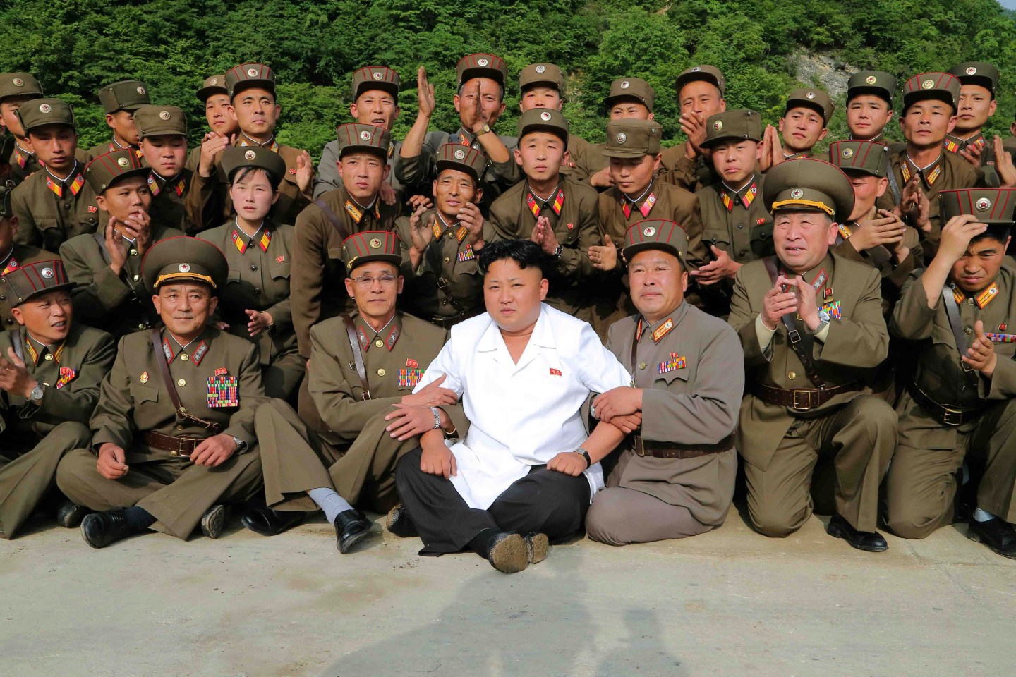 North Korean leader Kim Jong Un poses with soldiers in this undated photo released by North Korea's Korean Central News Agency (KCNA) in Pyongyang