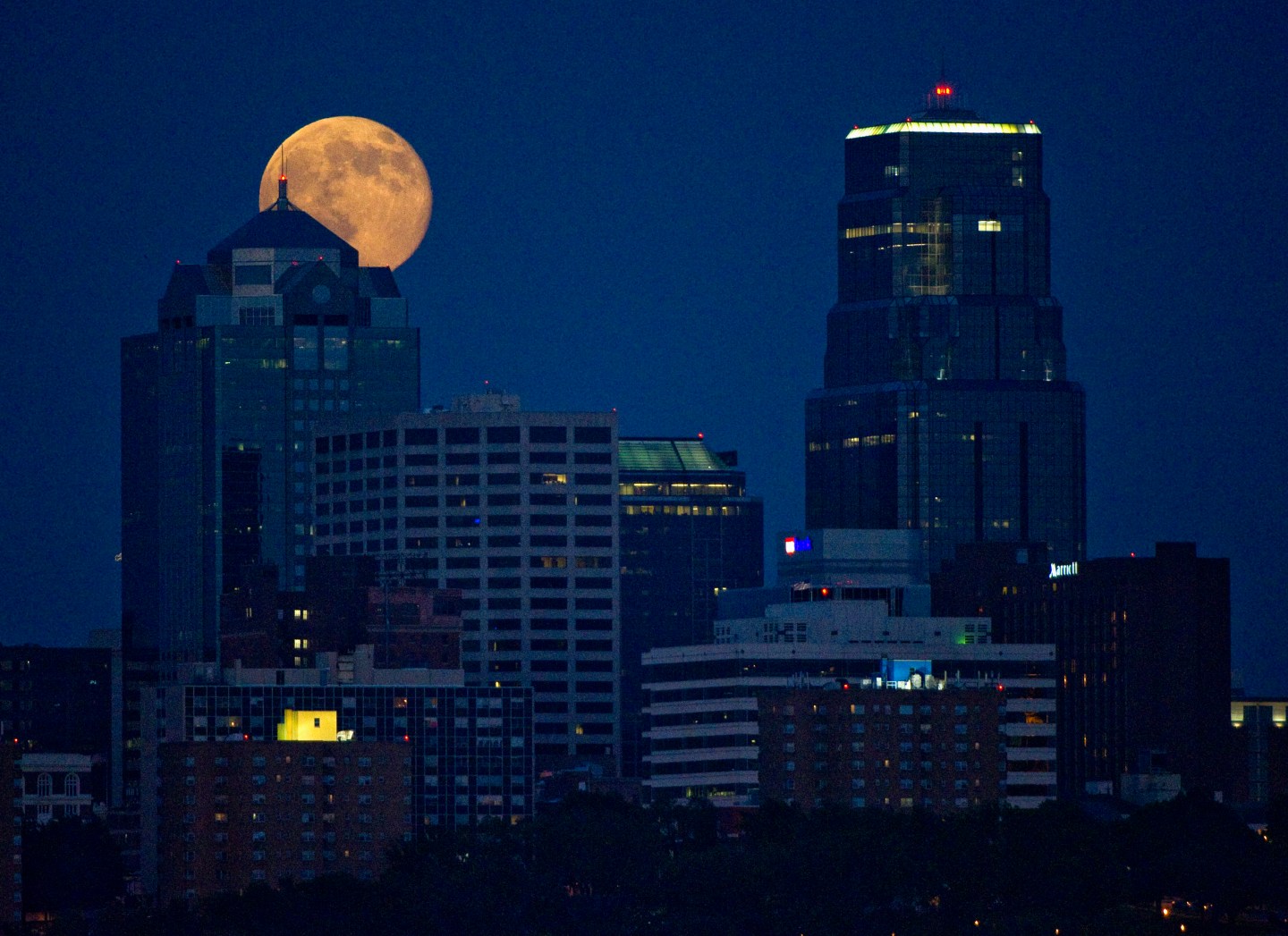 The Supermoon rises over downtown Kansas City, Missouri