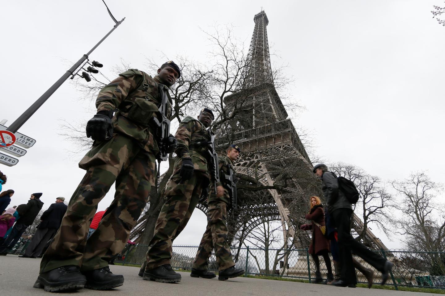 French soldiers patrol near the Eiffel Tower in Paris as part of the "Vigipirate" security plan
