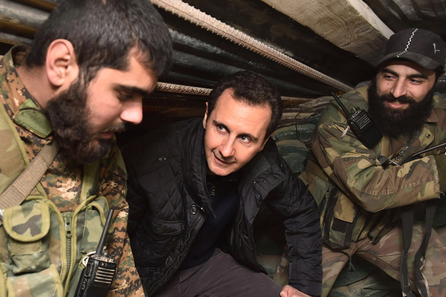 Syrian President Bashar al-Assad talks to soldiers during his visit to Jobar, northeast of Damascus