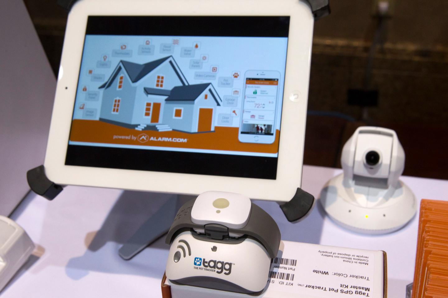 Tagg pet tracker at shown in an Alarm.com booth during the 2015 International Consumer Electronics Show in Las Vegas