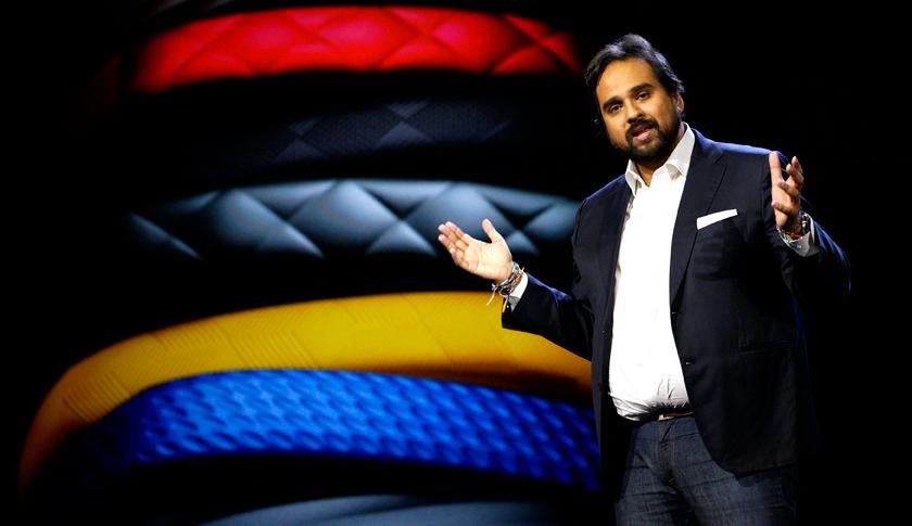 Rahman, CEO and co-founder of Jawbone, speaks during the Samsung keynote with Jawbone products displayed in the background at the International Consumer Electronics show in Las Vegas