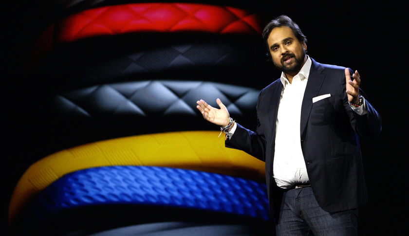Rahman, CEO and co-founder of Jawbone, speaks during the Samsung keynote with Jawbone products displayed in the background at the International Consumer Electronics show in Las Vegas
