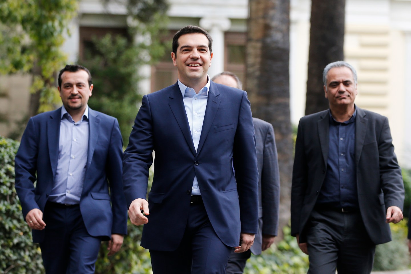 Greece's newly-appointed PM Tsipras leaves the Presidential Mansion after his swearing-in ceremony as Greece's first leftist prime minister in Athens