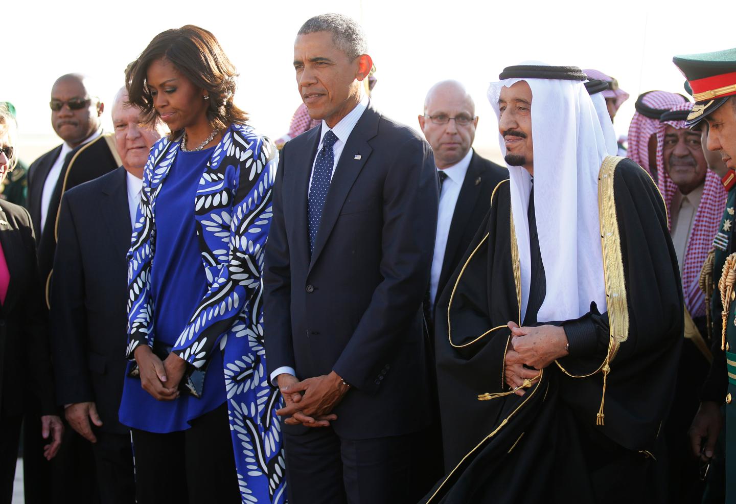 U.S. President Obama and first lady Michelle are greeted by Saudi Arabia's King Salman as they arrive at King Khalid International Airport in Riyadh