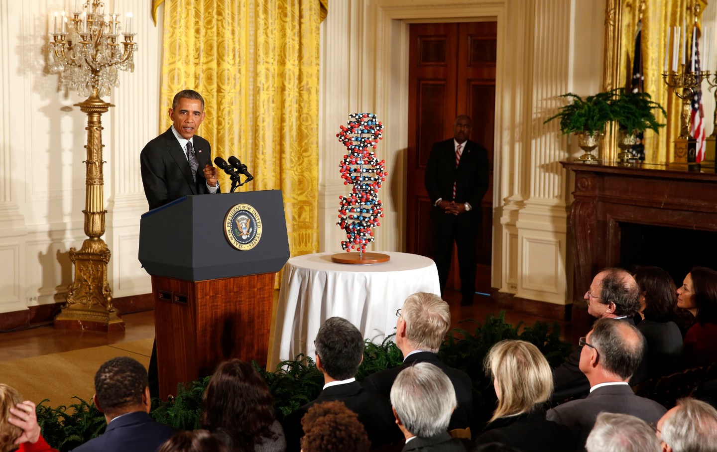 Obama talks about investments to improve health and treat disease through precision medicine while in the East Room of the White House in Washington