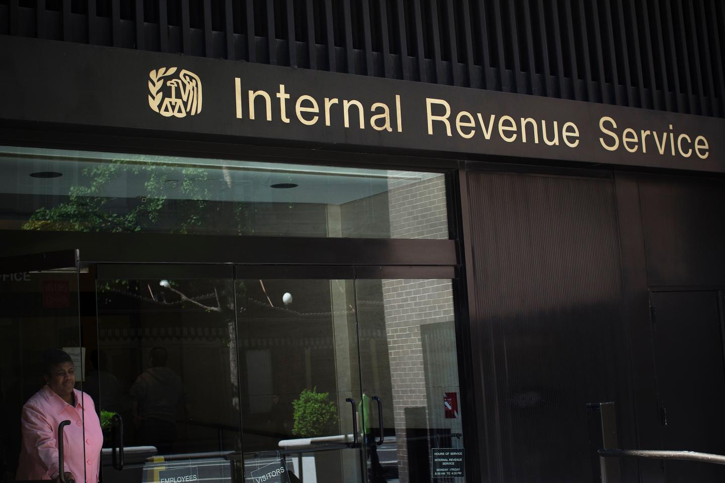 A woman walks out of the Internal Revenue Service building in New York
