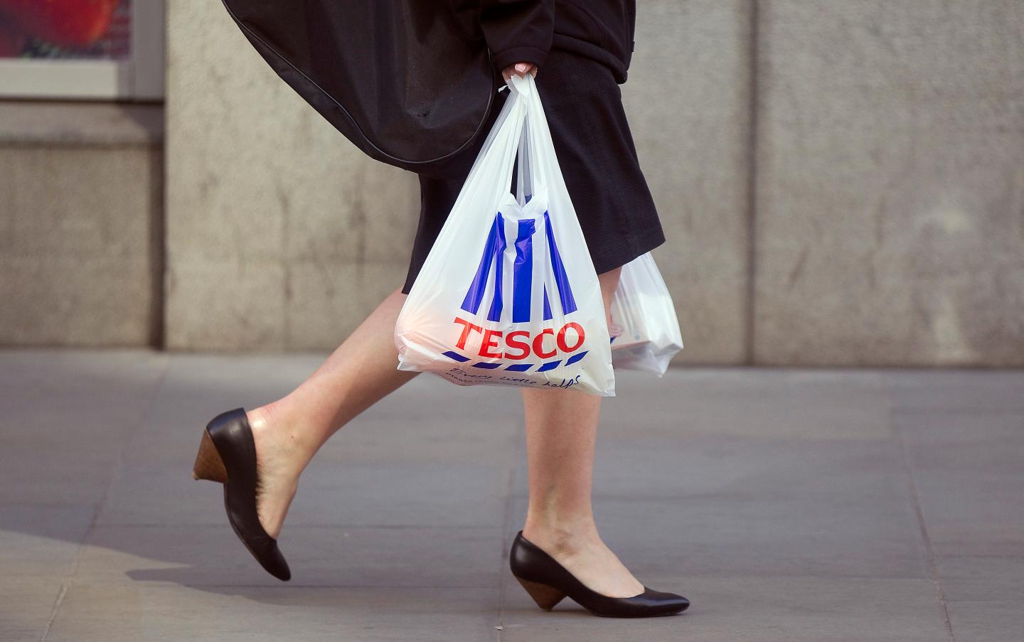 Tesco Plc Metro Stores As U.K. Business Flags
