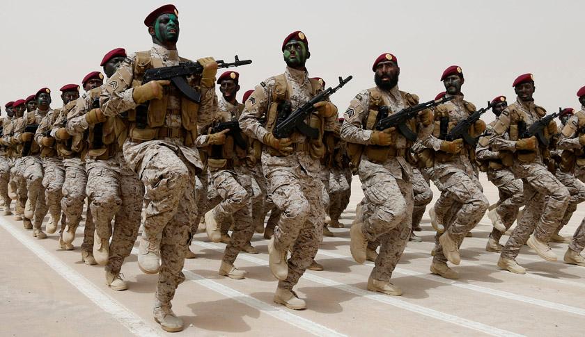Saudi soldiers march during Abdullah's Sword military drill in Hafar Al-Batin, near the border with Kuwait