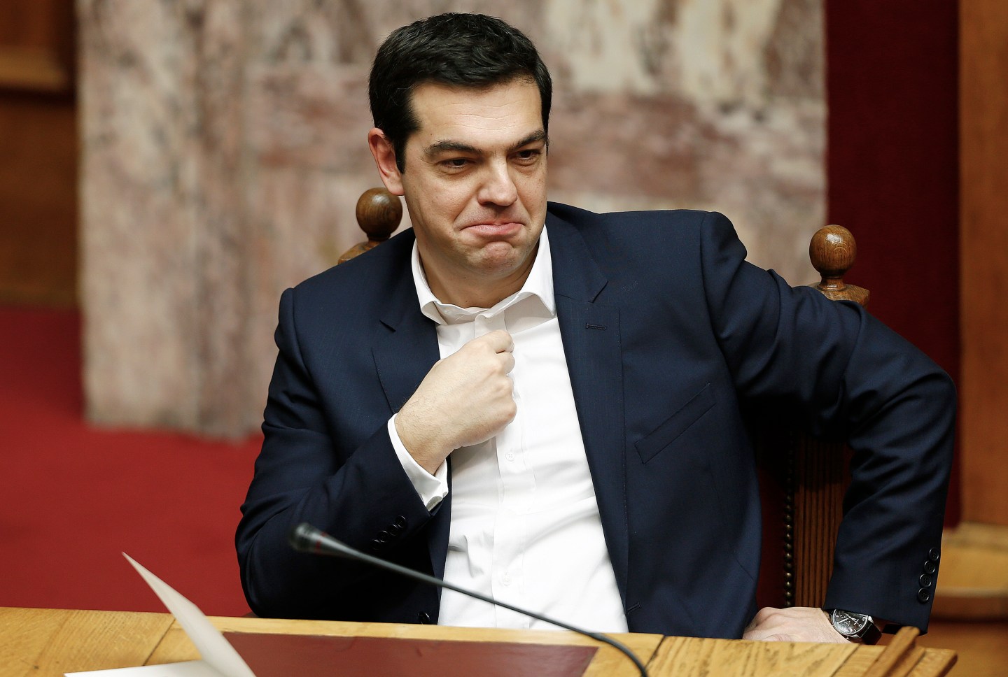 Alexis Tsipras, Greece's prime minister, sits and waits ahead of the swearing-in ceremony for the new government held in the Greek Parliament building in Athens, Greece, on Thursday, Feb. 5, 2015. Greece held fast to demands to roll back austerity as the European Central Bank turned up the heat before Finance Minister Yanis Varoufakis was to meet one of his main antagonists, German counterpart Wolfgang Schaeuble. Photographer: Yannis Behrakis/Pool via Bloomberg *** Local Caption *** Alexis Tsipras