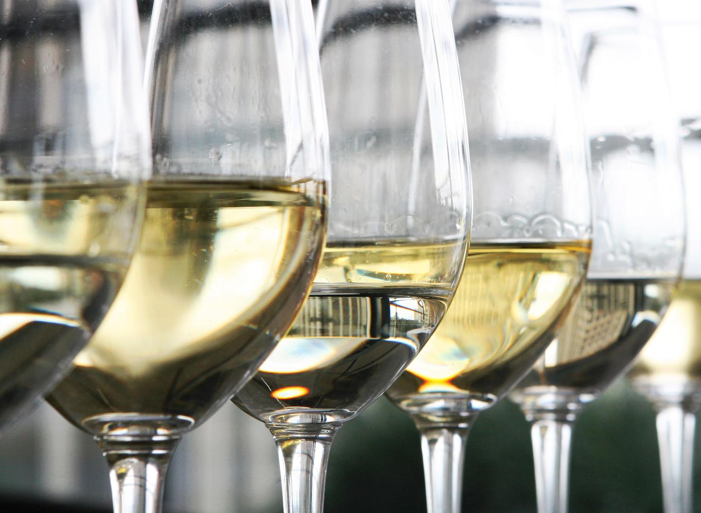 Glasses of white wine sit on display at a restaurant in Lond
