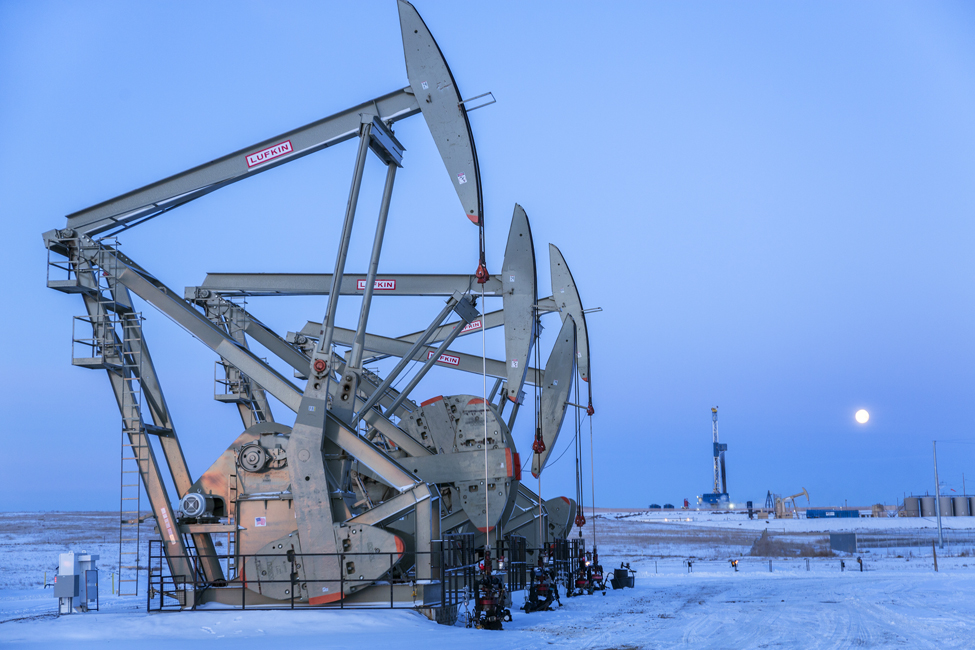 New pump jacks bringing up sweet crude oil from the Bakken shale deposits in the Williston Basin, some ten miles north of Williston, ND.  This drilling pad is on the Smith Farm, and is managed by Statoil.
