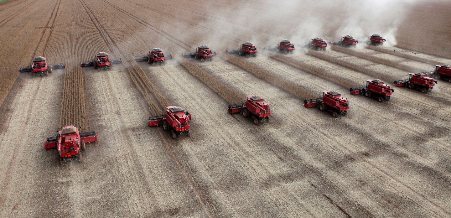 Workers harvest soybeans in a farm in Tangara da Serra in Cuiaba