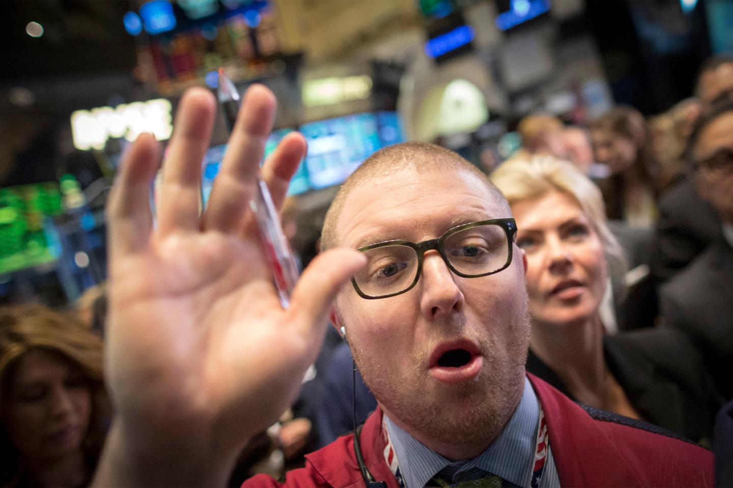 Traders work on the floor of the New York Stock Exchange