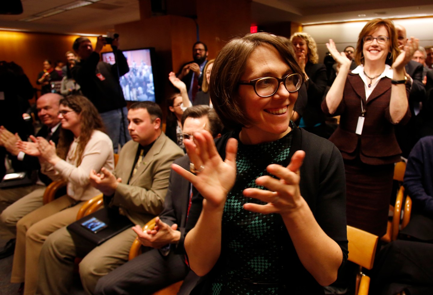 Members of the audience react after Federal Communications Commission voting at Net Neutrality hearing in Washington