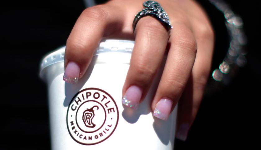 A girl holds a drink from Chipotle Mexican Grill restaurant in Redlands
