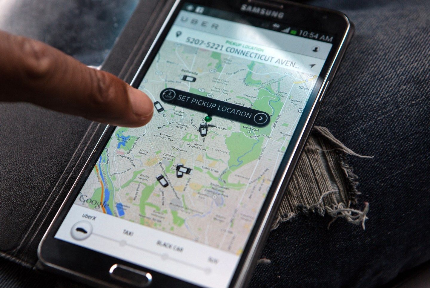 Caption:WASHINGTON, DC - APR 4: UberX driver, Michael Belet, checks the Uber customer app to see where other Uber drivers are working so he can determine where the best place for him to get fares might be, April 7, 2014, in Washington, DC. Thousands of local car owners have signed up in recent months to drive with one of the 'ride-share' operators that use smartphone apps to link people needing rides with car owners willing to give them, for a price. (Photo by Evelyn Hockstein/For The Washington Post via Getty Images)
