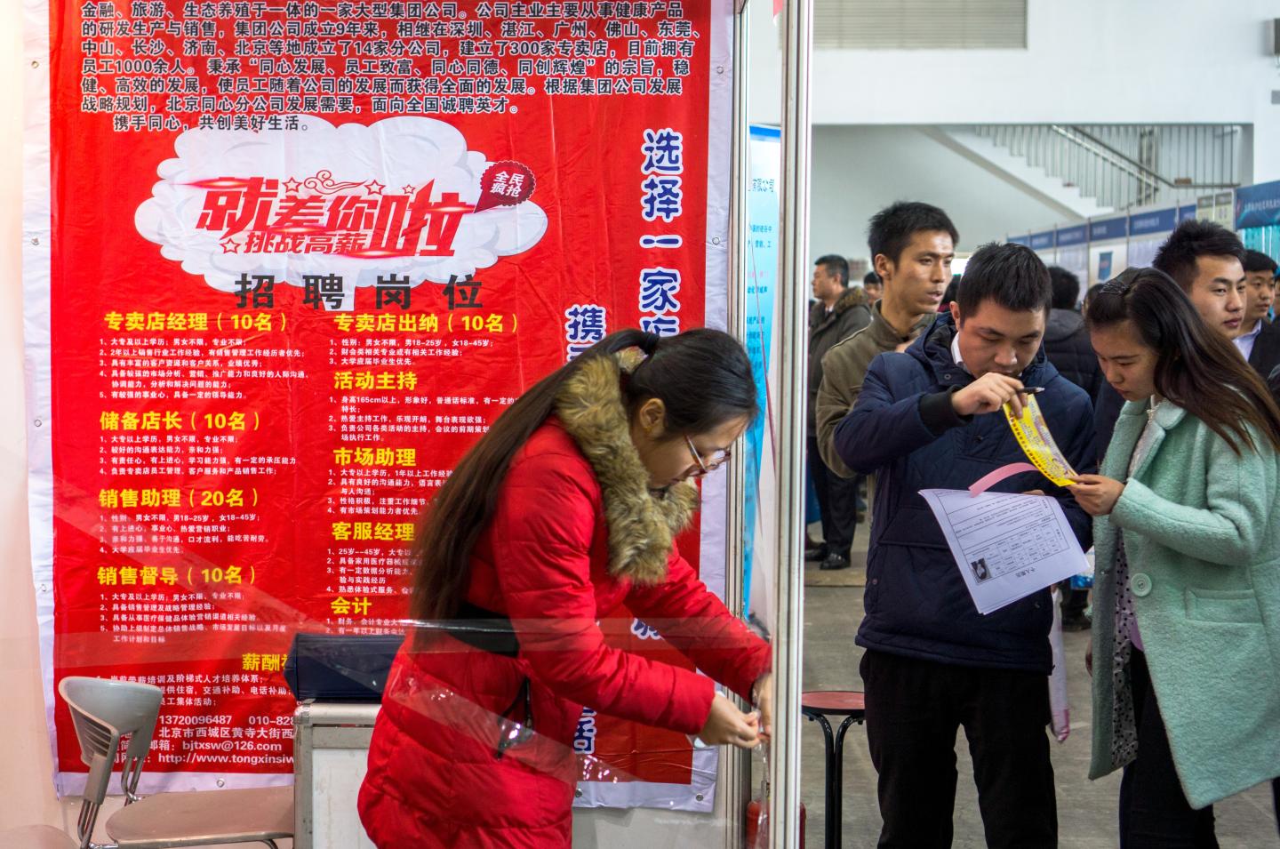 Job seekers in a recruitment fair.    With the slowdown of