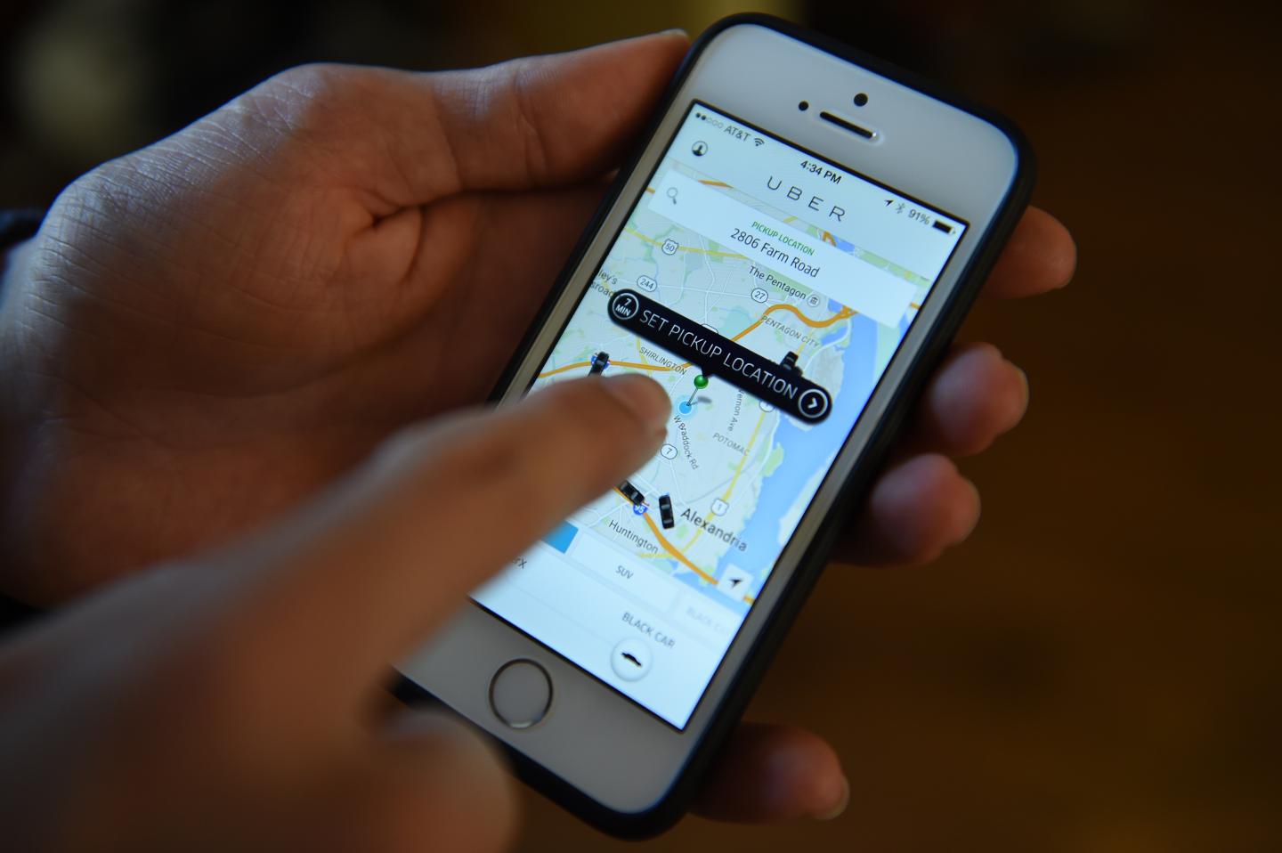 ALEXANDRIA, VA - FEBRUARY 27:  Sam Landa, 15, uses the Uber ap