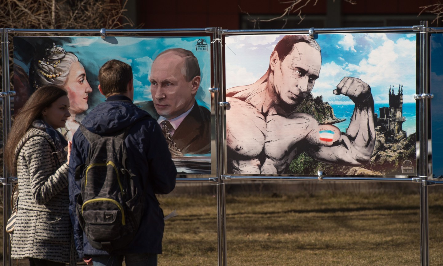RUSSIA-UKRAINE-CRISIS-CRIMEA-ANNIVERSARY-CARTOONS-EXHIBITION