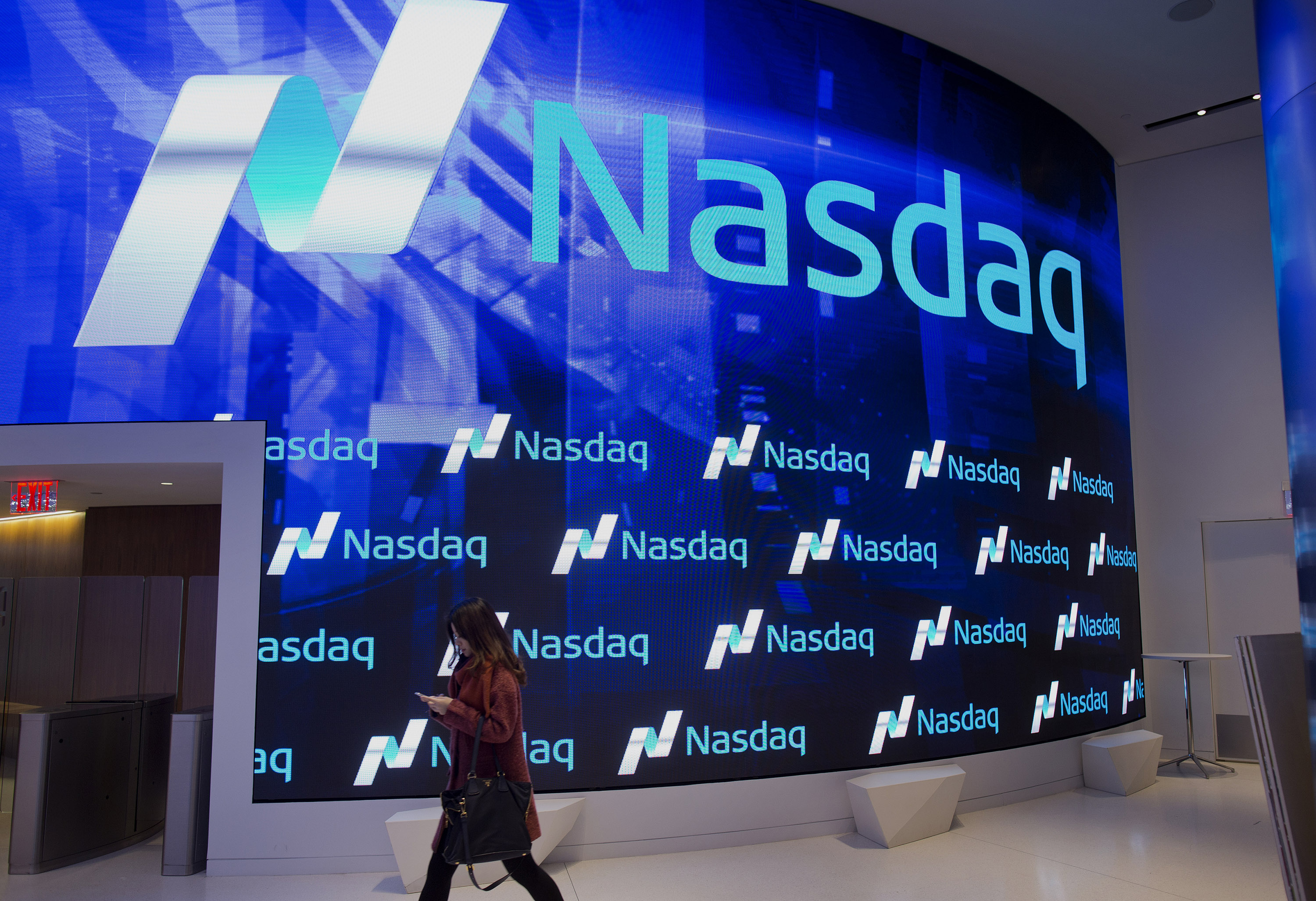 A visitor walks through the new lobby at the Nasdaq stock exchange in Times Square in New York, NY, Friday, December 19, 2014.Photograph: Victor J. Blue