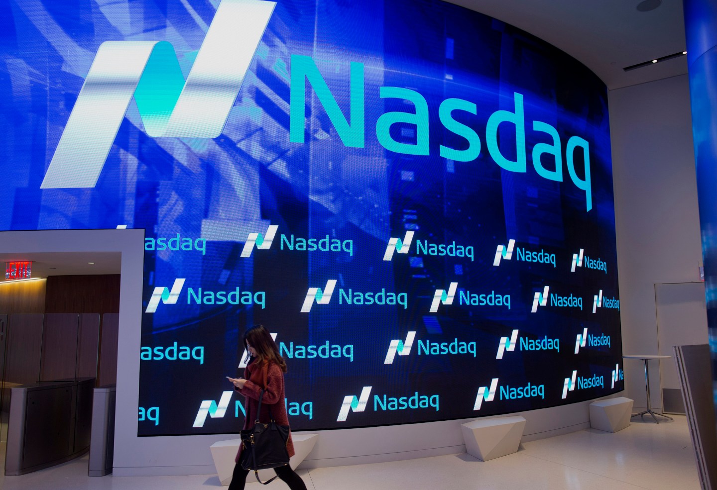 A visitor walks through the new lobby at the Nasdaq stock exchange in Times Square in New York, NY, Friday, December 19, 2014.Photograph: Victor J. Blue