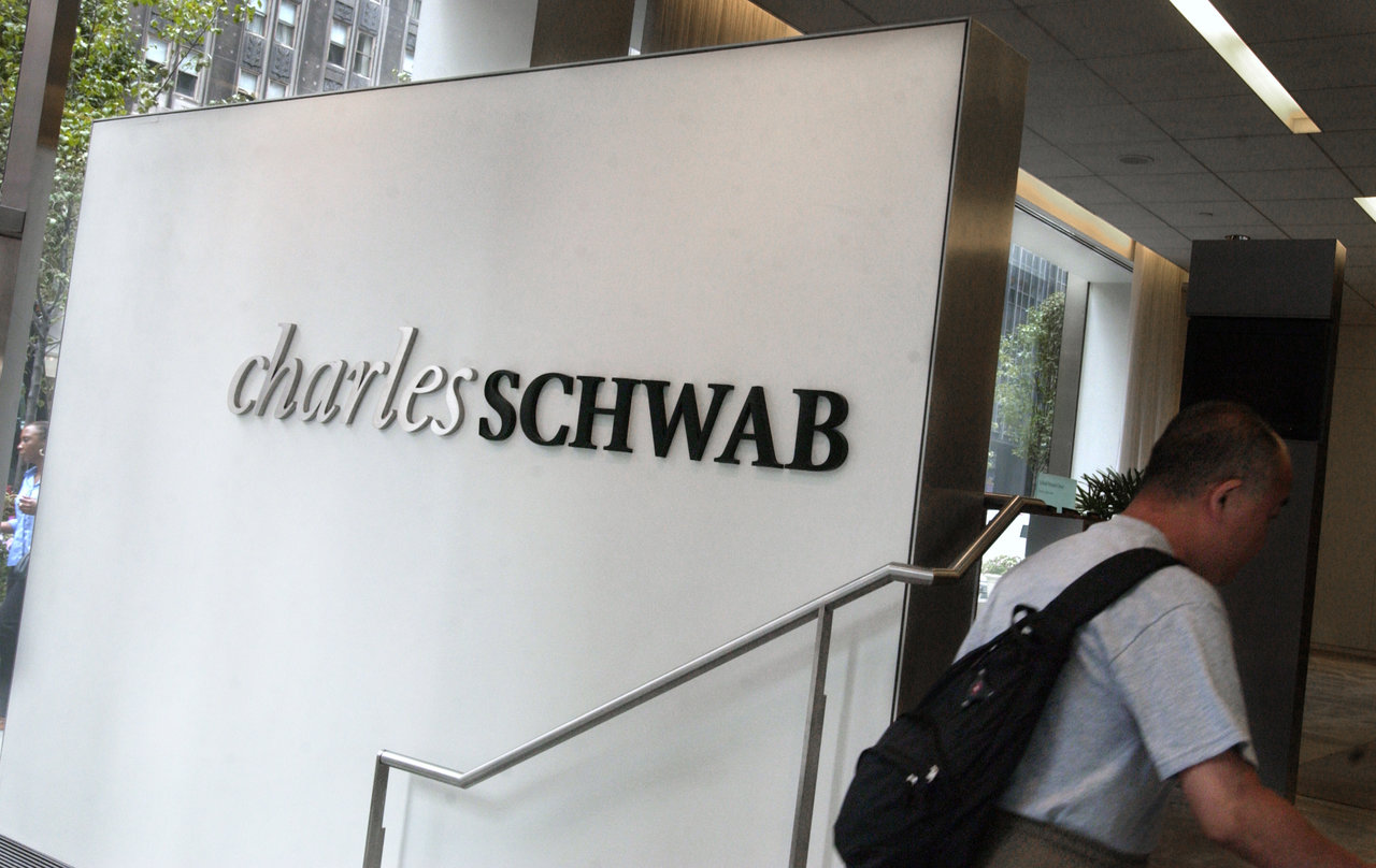 The Charles Schwab logo is displayed inside the lobby of the