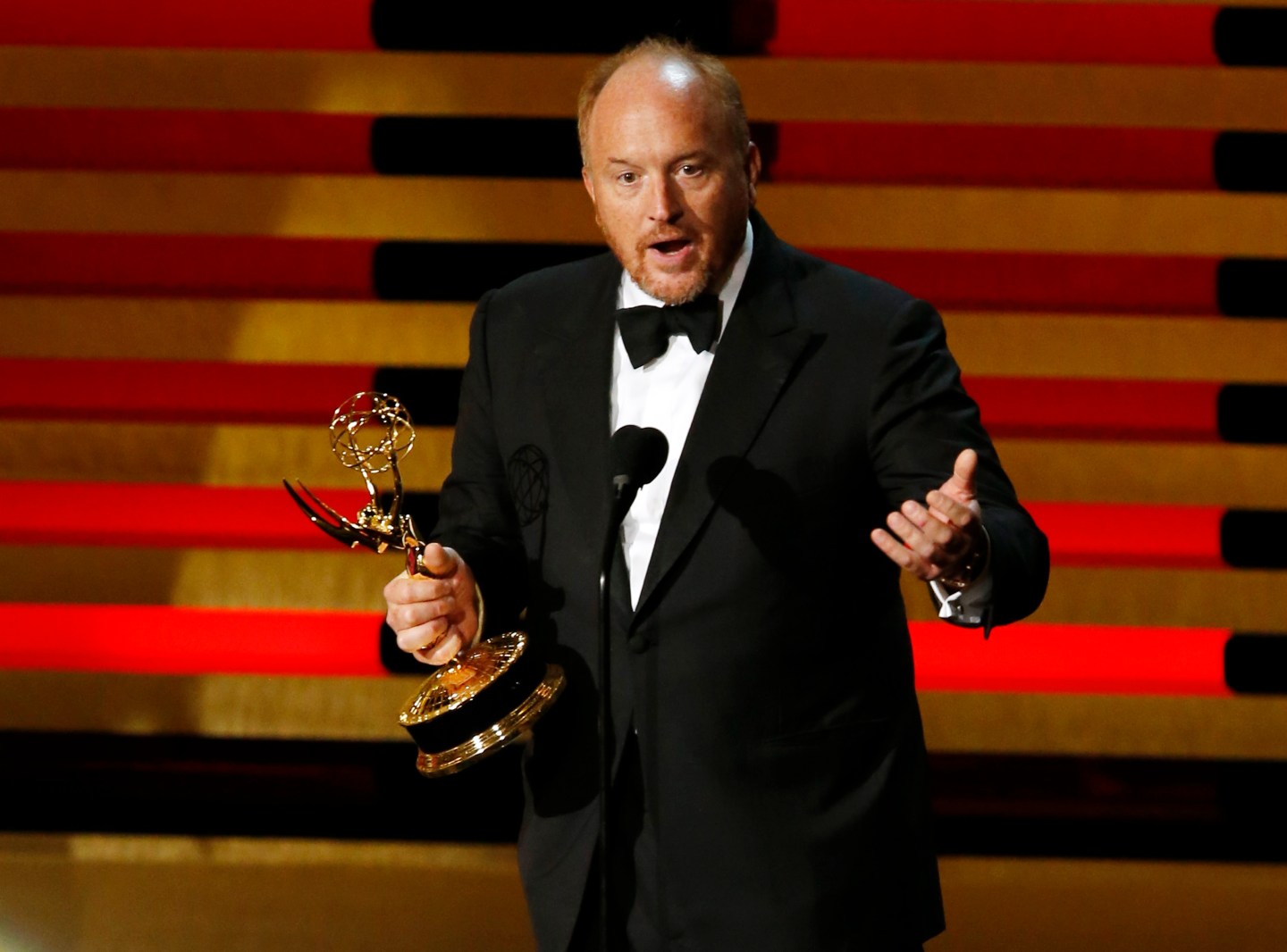 Louis C.K. accepts the Emmy award for Outstanding Writing for a Comedy Series for "Louie" onstage during the 66th Primetime Emmy Awards in Los Angeles