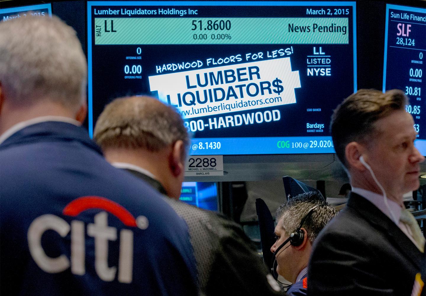 Traders wait for shares of Lumber Liquidators to begin trading on the floor of the New York Stock Exchange