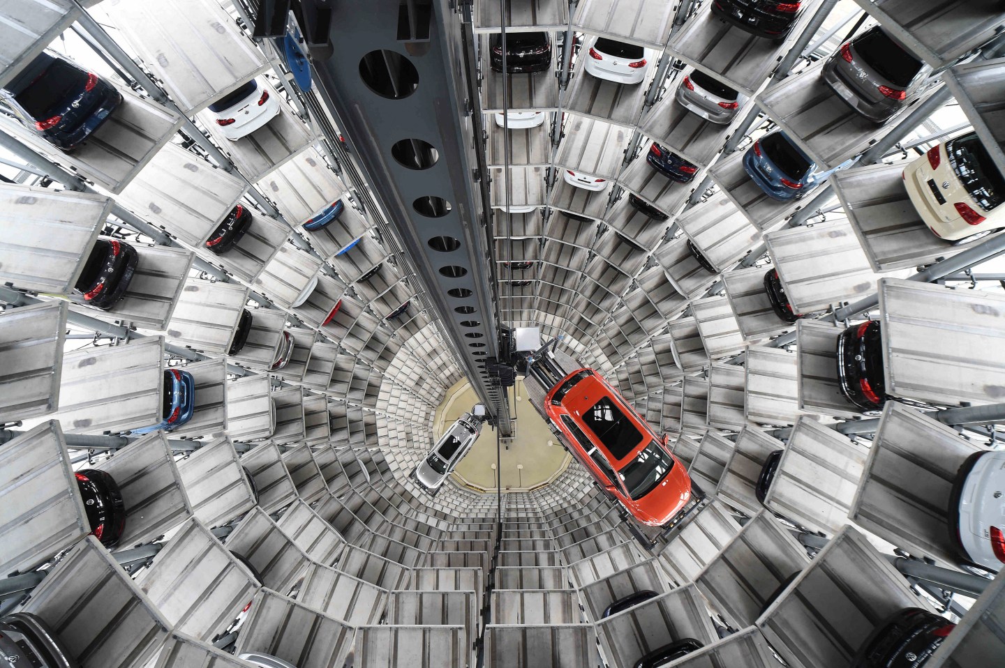 A VW Golf VII car and a VW Passat are loaded in a delivery tower at the plant of German carmaker Volkswagen in Wolfsburg