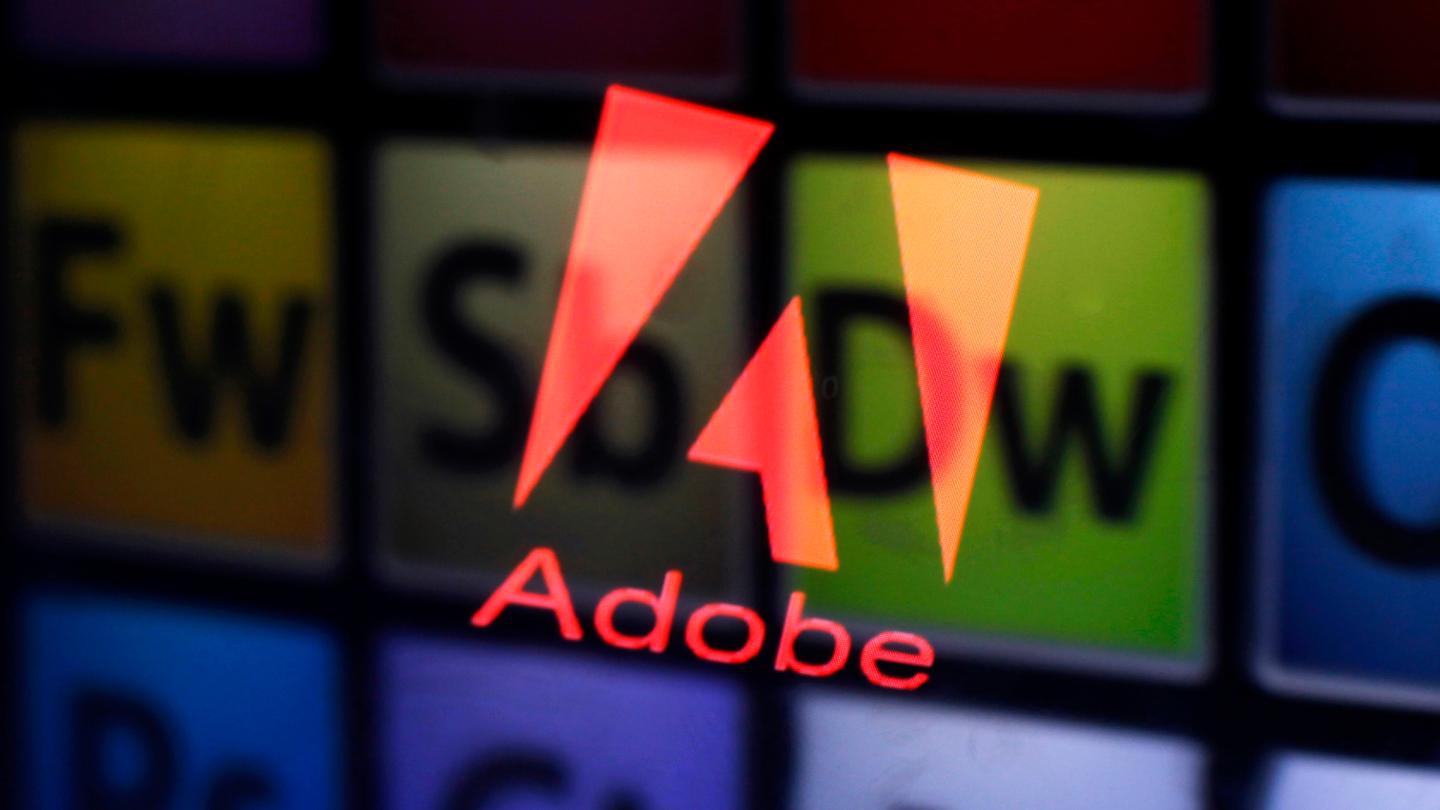 Picture illustration shows Adobe logo and Adobe products reflected on a monitor display and an iPad screen, in central Bosnian town of Zenica