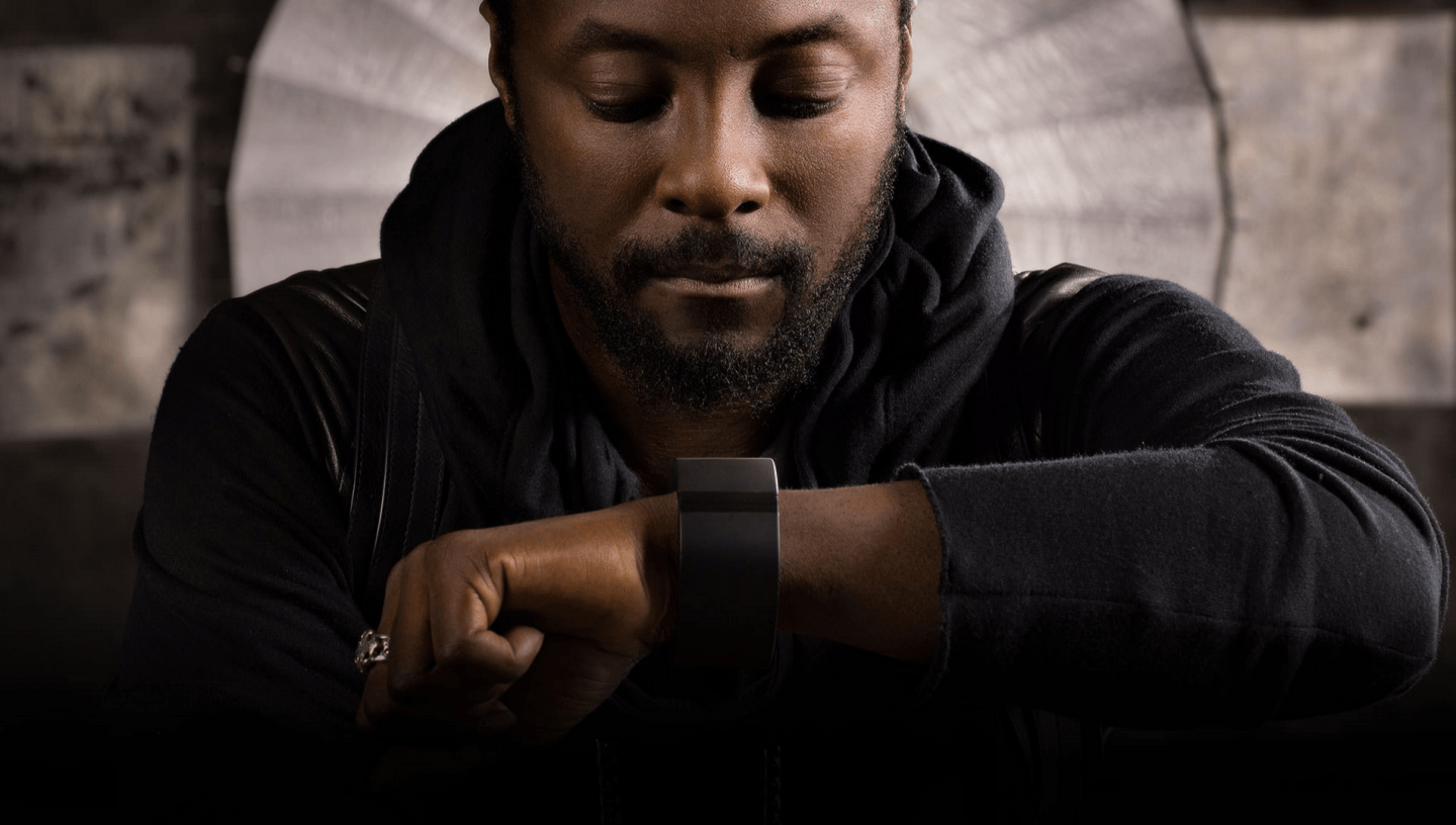 Will.i.am wearing Puls band