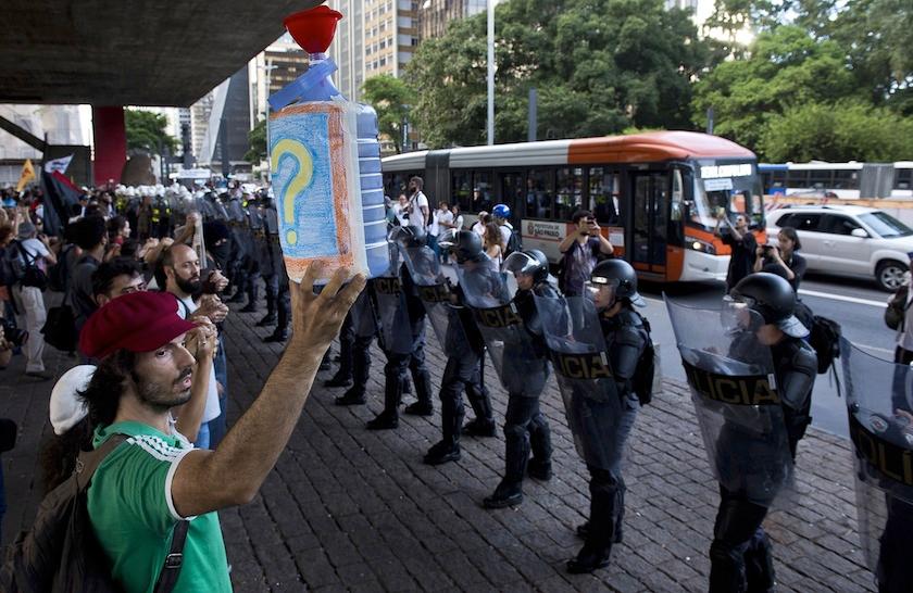 Demonstrators protest the lack of water in front of a police barricade in Sao Paulo, Brazil