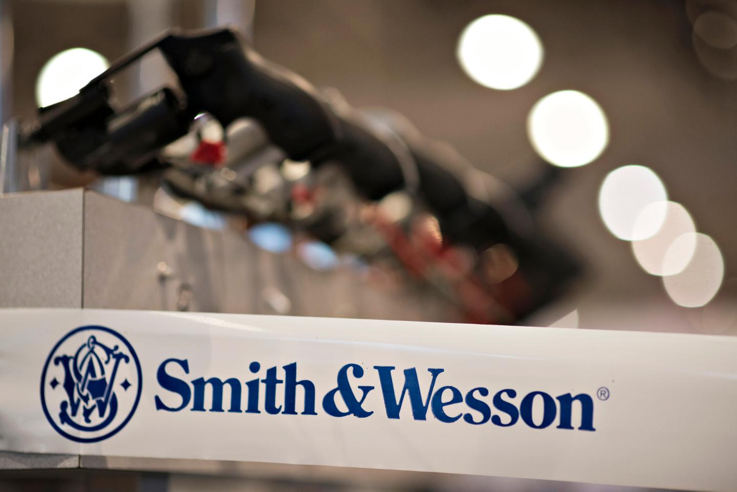 A Smith & Wesson Holding Corp. logo appears on tape surrounding the company booth on the exhibition floor ahead of the 144th National Rifle Association (NRA) Annual Meetings and Exhibits at the Music City Center in Nashville, Tennessee, U.S., on Thursday, April 9, 2015. Top Republican contenders for their party's 2016 presidential nomination are lining up to speak at the annual NRA event, except New Jersey Governor Chris Christie and Kentucky Senator Rand Paul who were snubbed by the country's largest and most powerful gun lobby. Photographer: Daniel Acker/Bloomberg